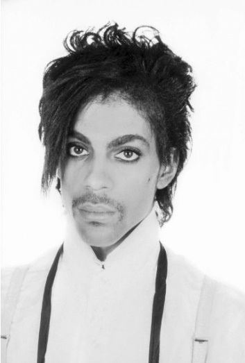 A black and white portrait photograph of Prince taken in 1981 by Lynn Goldsmith